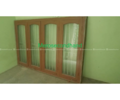 wooden window with glass and grill